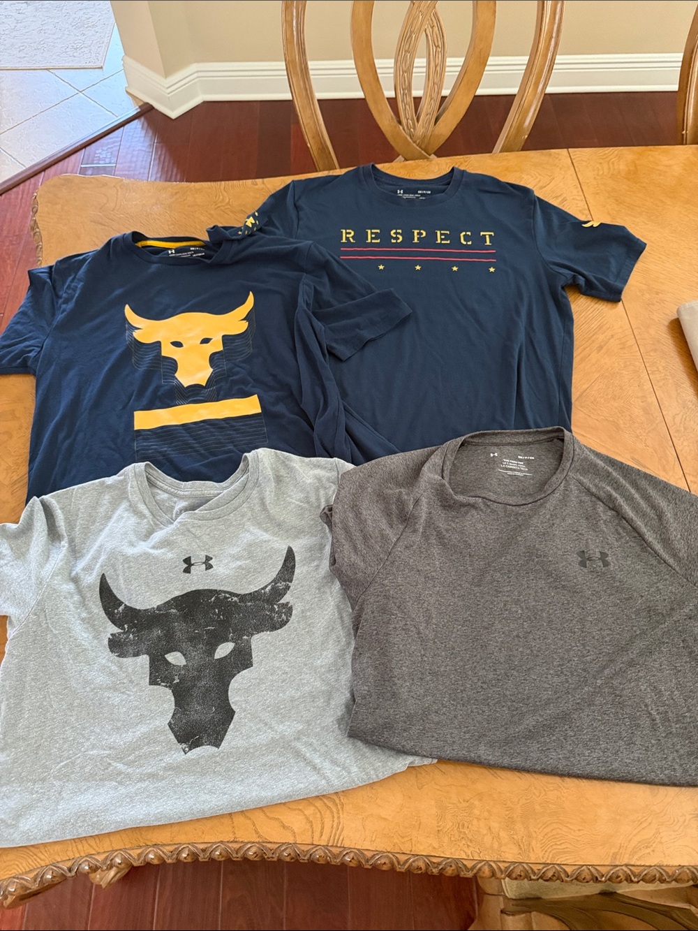 4 Under Armour Men’s Short Sleeve Tees in Navy, Gray, and Heather